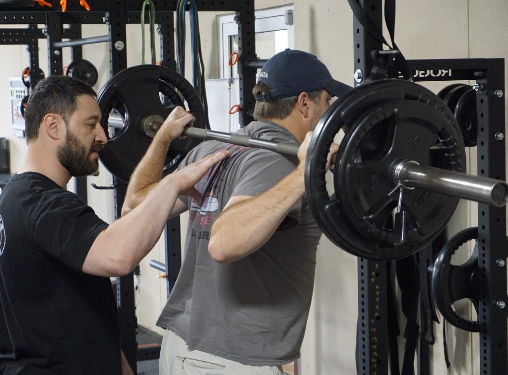 Coach Scott leading a strength and body sculpting class at Studio Fit